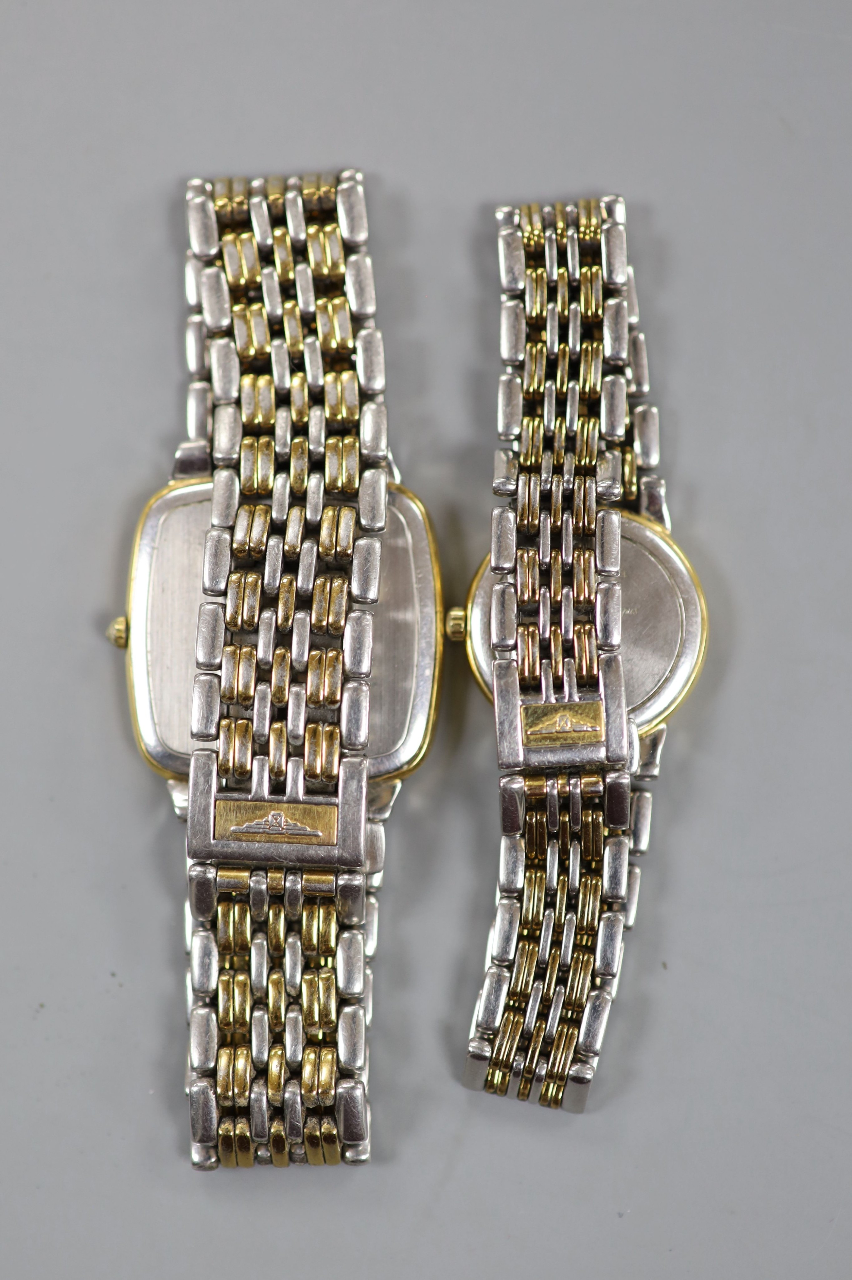 A gentleman's steel and gold plated Longines quartz wrist watch and a similar lady's watch.